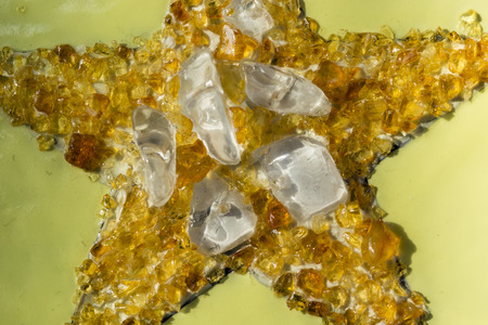 Amber and Crystal glued into the shape of a star.