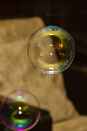 Soap bubbles flying around the room.の写真素材