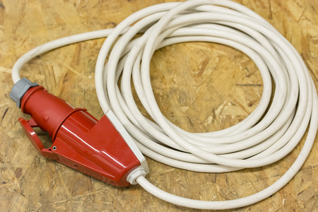 Curved extension with plug and socket for three-phase voltage.の写真素材