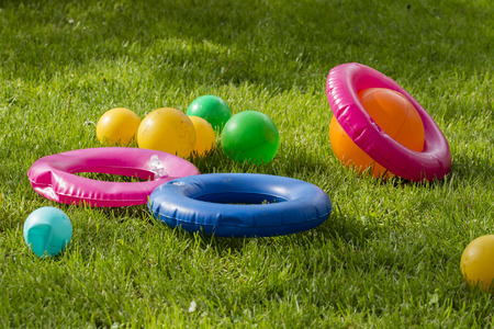 Plastic balloons and inflatable circles.