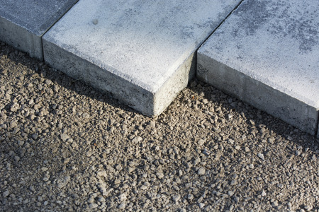 Undulated walkway - Laying tiles on a gravel bed.の写真素材