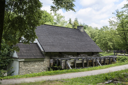 An old forge with water and a water tank.