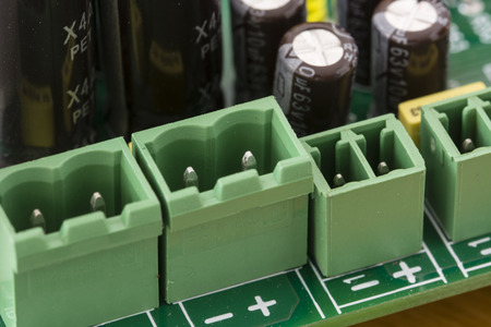 Green connectors on the printed circuit board.の写真素材