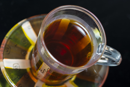 Glass with hint of tea.の写真素材