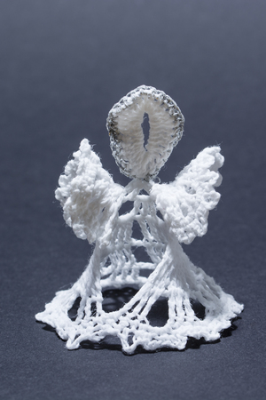 A handkerchief knitted white with a black background.の写真素材