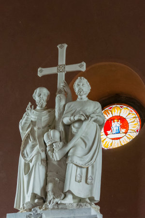 Statue of Cyril and Methodius with a cross in a church.のeditorial素材