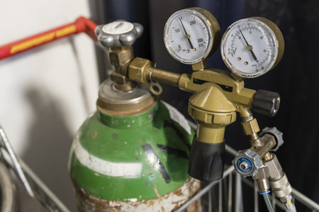 Argon pressure cylinder and pressure regulator.