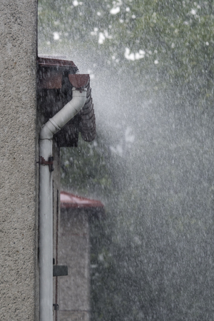Splashing water from part of the roof at the gutter.