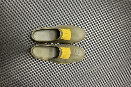 Protective rubber shoe covers in substation.