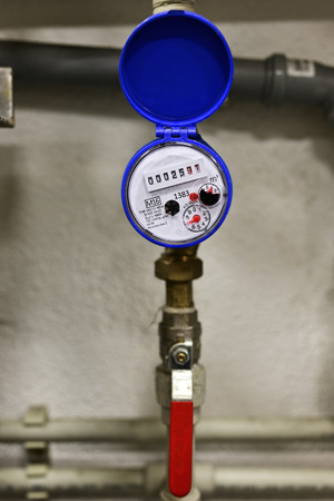 Water flow measurement - water meter not covered by pipe lever.の写真素材