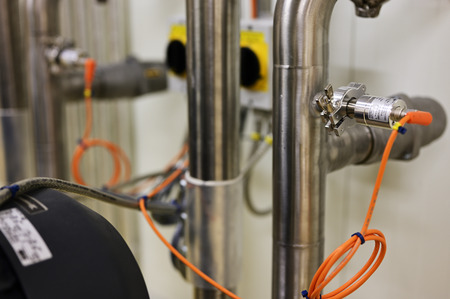 Vacuum sensor on stainless steel pipe.