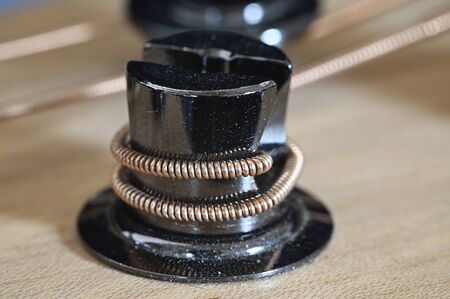Metal stretch parts with bass guitar string.