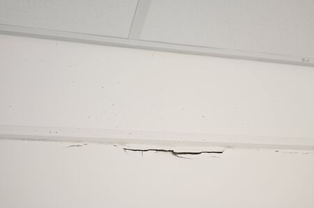 Cracks in the plaster under the ceiling.の写真素材