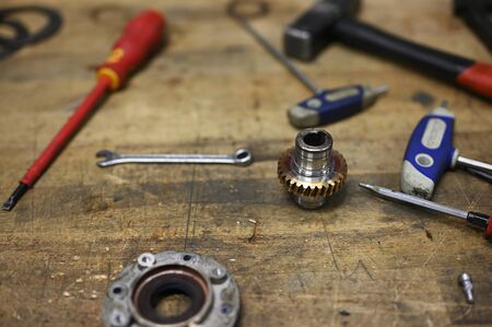 Gear from gear on table with tools.の写真素材