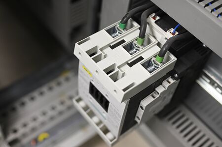 Large three-phase contactor in the control cabinet.の素材 [FY310129694558]