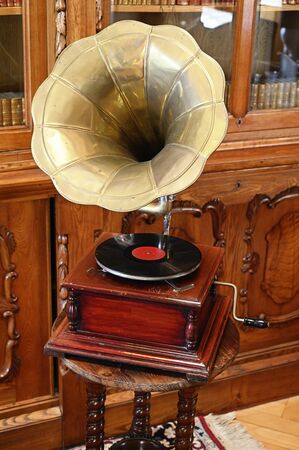 Old turntable with record and handle.の写真素材