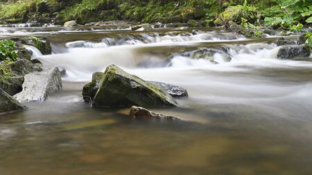 Water flowing among stones in nature in detail.の写真素材