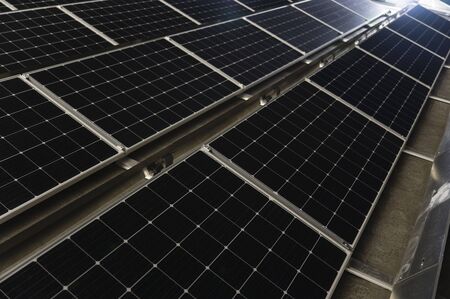 Illuminated panels on the evening roof.の写真素材