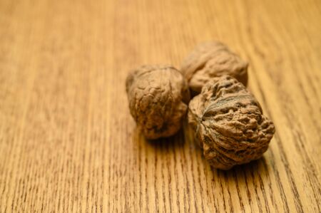 Three nuts lying on the table.