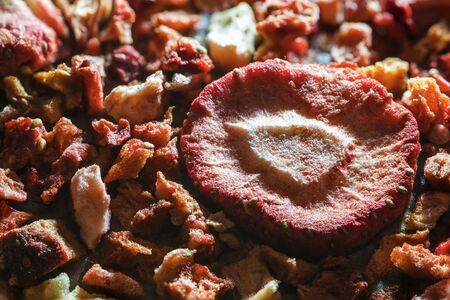 Dried strawberries on milk chocolate.の写真素材