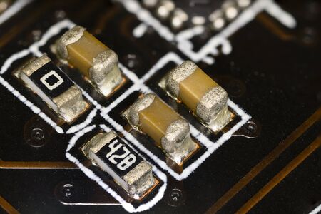 Miniature resistors on computer motherboard.