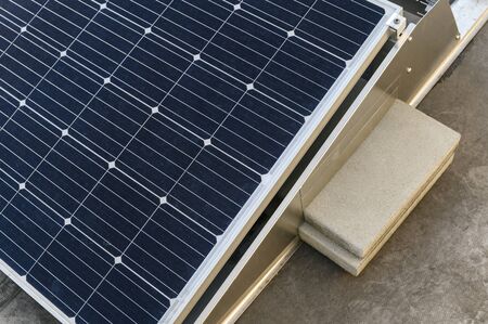 Load using a tiled solar panel holder on the roof.の写真素材