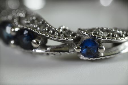 Blue sapphires in an engagement ring with zircons.の写真素材