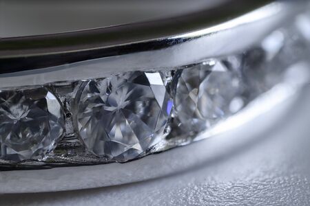 Detail of clear diamonds on a white gold ring.