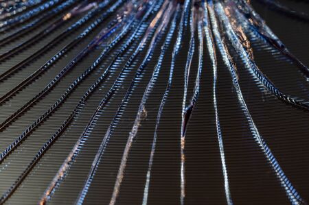 Cracks on the glass of a mobile phone in detail.