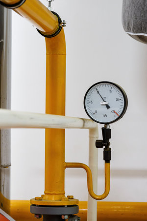 Circular analog pressure gauge with scale on the gas line.の写真素材