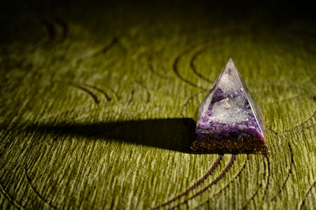 Orgonite pyramid with crystal in detail.の写真素材