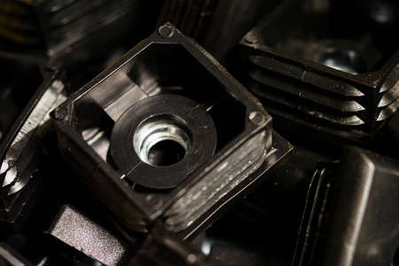 Black plastic tap inserts with nut inside.の写真素材