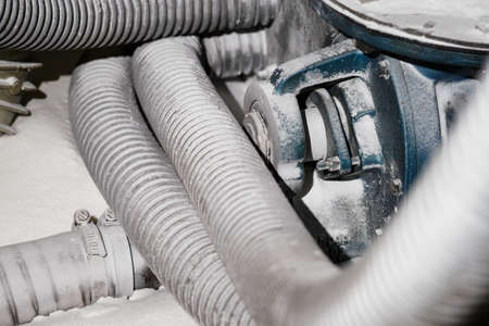 Part of a feeder with flexible tubes dusted with sugar.の写真素材