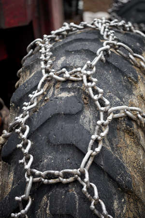 Chains on the tires of a logging tractor.の写真素材