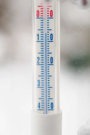 Detail of an outdoor mercury thermometer with a freezing value.の写真素材
