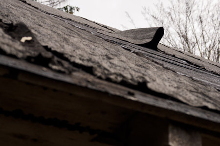 Crumbling roof covering on the roof.の写真素材
