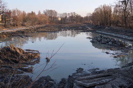 Reconstruction of the pond with stones.の写真素材