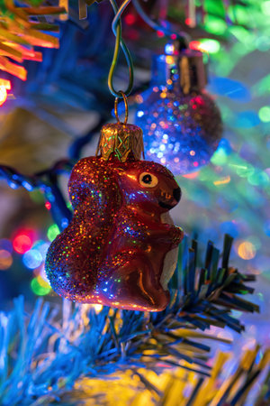 Christmas decoration squirrel with tinsel.の写真素材