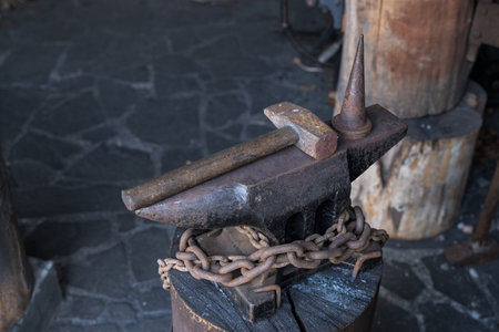 Anvil with hammers in a forge with a mandrel.の写真素材