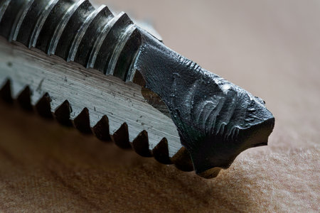 Macro detail of a broken part of a machine tap.