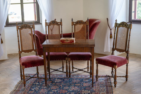 Interior of a room in an old house, with a red chairの写真素材