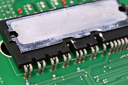 Large processor on a board with leftover thermal paste on the top.