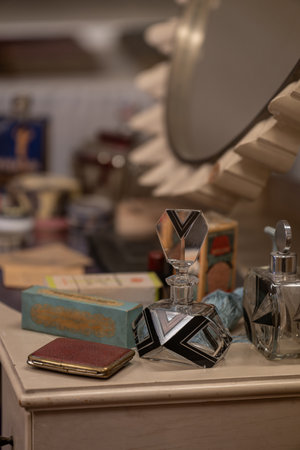 An old cigarette case lying next to a retro perfume in cut glass.の写真素材