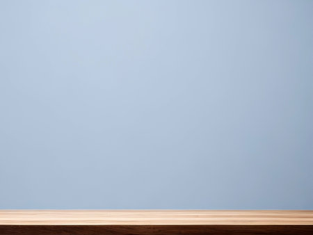 Empty top of wooden table and blue wall background. For product display.の素材