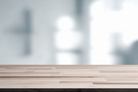 Wood table top on blur window glass, wall background with sunlight. For montage product display.の素材