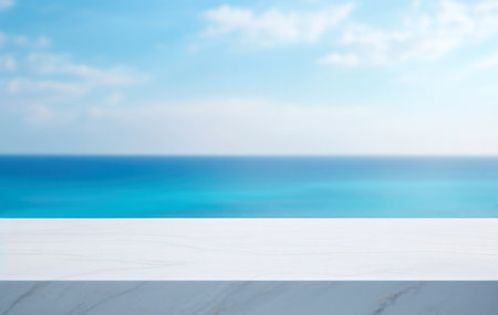Empty white marble table top over blurred sea and sky background, for product display montage. High quality photoの素材
