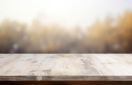 Empty wooden tabletop with a clear surface and blurred nature backdrop. Ideal for product displays or presentations. High quality photoの素材