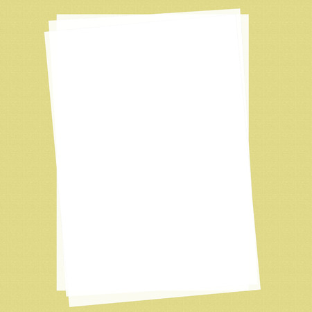 Office A4 sheet of paper lying on a yellow backgroundの写真素材