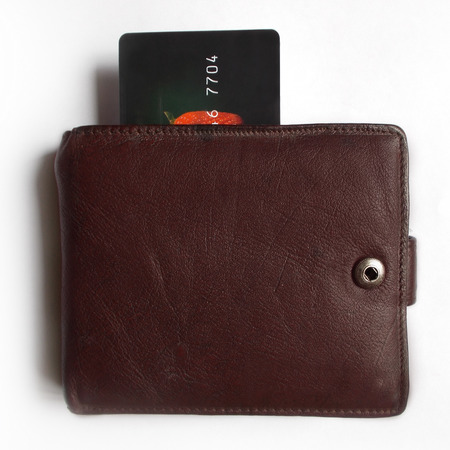 Credit card in a purse isolated on white background