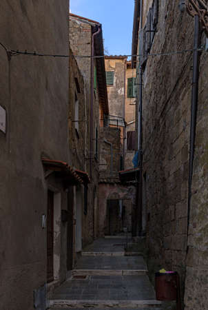Narrow street at the old town of Pitigliano at the Tuscany Region in Italyの写真素材